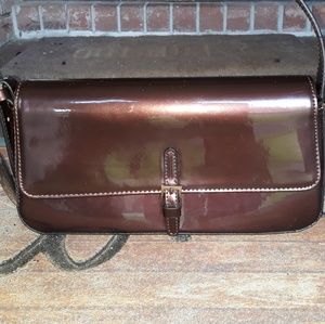 A Latrelle Fashion patent leather purse.